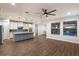 Spacious living area with hardwood floors and kitchen views at 12232 Perennial Pl, Lakewood Ranch, FL 34211