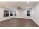 Bright living room featuring hardwood floors and ceiling fan at 12232 Perennial Pl, Lakewood Ranch, FL 34211