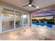 Covered patio overlooking pool and lake at 12232 Perennial Pl, Lakewood Ranch, FL 34211