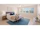 Bright and airy main bedroom with water views and a large bed at 1240 Dolphin Bay Way # 204, Sarasota, FL 34242