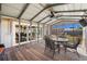 Relaxing screened porch with ceiling fan and outdoor dining set at 1243 Inverness St, Port Charlotte, FL 33952