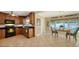 Well-equipped kitchen with wood cabinets, black appliances, and tile floors at 1310 Pomelo Ave, Sarasota, FL 34239