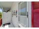 Mobile home entrance with nautical decor and storage closet at 136 S Park Dr, Venice, FL 34285