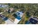 Aerial view of a home, pool, and surrounding neighborhood at 13618 2Nd Ne Ave, Bradenton, FL 34212