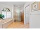 Spa-like bathroom with a large soaking tub and glass block shower at 13618 2Nd Ne Ave, Bradenton, FL 34212