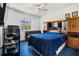 Comfortable guest bedroom with a full-size bed and built-in shelving at 13618 2Nd Ne Ave, Bradenton, FL 34212