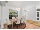 Bright dining room with an oval table and seating for six at 13618 2Nd Ne Ave, Bradenton, FL 34212