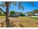 House exterior with a red door and well-maintained landscaping at 13618 2Nd Ne Ave, Bradenton, FL 34212