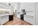 Well-equipped kitchen featuring ample counter space and white cabinets at 13618 2Nd Ne Ave, Bradenton, FL 34212