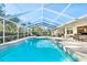 Inviting, refreshing pool with screened enclosure and patio furniture at 13618 2Nd Ne Ave, Bradenton, FL 34212