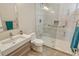 Modern bathroom with a walk-in shower, updated fixtures, and stylish tile at 145 N Washington Dr, Sarasota, FL 34236