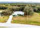 Aerial view of single-story home with large backyard and driveway at 1496 Palm View Rd, Sarasota, FL 34240