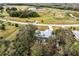 Aerial view showing house, pool, and surrounding land at 1496 Palm View Rd, Sarasota, FL 34240