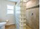 Bright bathroom features a glass block shower wall and modern tile at 1496 Palm View Rd, Sarasota, FL 34240