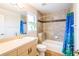 Bright bathroom with a tub/shower and modern sink, complemented by a plant in the window at 1496 Palm View Rd, Sarasota, FL 34240