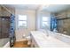 Bathroom featuring a bathtub, shower and large mirror at 1496 Palm View Rd, Sarasota, FL 34240