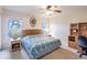 Bedroom featuring a large bed, matching nightstands, and large windows at 1496 Palm View Rd, Sarasota, FL 34240