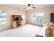 Bedroom featuring large windows, a ceiling fan, and a wooden desk with chair at 1496 Palm View Rd, Sarasota, FL 34240
