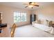 Bedroom showcasing a large window, ceiling fan, and white couch at 1496 Palm View Rd, Sarasota, FL 34240