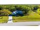 Charming single-story home with a well-maintained lawn and mature trees providing shade and curb appeal at 1496 Palm View Rd, Sarasota, FL 34240