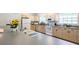 Bright kitchen with modern appliances, gray counter tops, wood cabinets and a large sink with a window view at 1496 Palm View Rd, Sarasota, FL 34240