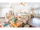 Bright living room with wood floors, comfortable seating and an open view of the kitchen at 1496 Palm View Rd, Sarasota, FL 34240