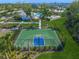 Well-maintained outdoor basketball court in a community setting at 15033 Shady Palms Ln, Nokomis, FL 34275