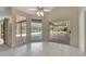 Dining area with sliders opening to the pool and patio at 15903 Armistead Ln, Odessa, FL 33556