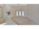 Open living area with tile and carpeted floors and access to backyard at 15903 Armistead Ln, Odessa, FL 33556