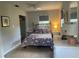 Bright bedroom with a floral comforter and plenty of closet space at 1680 17Th St, Sarasota, FL 34234