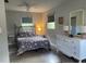 Cozy bedroom with a floral comforter and white dresser at 1680 17Th St, Sarasota, FL 34234