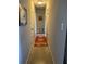 Long hallway with neutral walls and patterned rug at 1680 17Th St, Sarasota, FL 34234