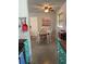 Teal kitchen with wood countertops and a small dining area at 1680 17Th St, Sarasota, FL 34234