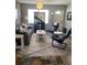 Living room with stone accent wall and comfortable seating at 1680 17Th St, Sarasota, FL 34234