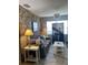 Living room featuring a stone accent wall and room divider at 1680 17Th St, Sarasota, FL 34234