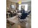 Living room with stone wall, gray sofa, and coffee table at 1680 17Th St, Sarasota, FL 34234