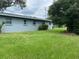 Side yard with grassy lawn at 1680 17Th St, Sarasota, FL 34234