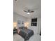 Spacious bedroom featuring a ceiling fan and window at 1718 Jagust Rd, North Port, FL 34288