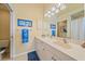 Double vanity bathroom with a large mirror and updated fixtures at 1761 Auburn Lakes Dr # 33, Venice, FL 34292