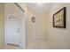 Small entryway with tiled floor and a window at 1761 Auburn Lakes Dr # 33, Venice, FL 34292