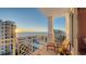 Spacious balcony overlooking the ocean with seating for relaxation at 2050 Benjamin Franklin Dr # B904, Sarasota, FL 34236