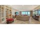 Bright living room with built in shelving and ocean view at 2050 Benjamin Franklin Dr # B904, Sarasota, FL 34236