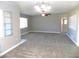 Large living room with neutral colored carpet and ceiling fan at 2215 18Th W Ave, Bradenton, FL 34205