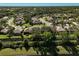 Aerial view of community with houses and landscaping at 2316 Harrier Way, Nokomis, FL 34275
