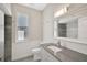 Updated bathroom with granite countertop and tiled shower at 2316 Harrier Way, Nokomis, FL 34275