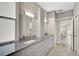 Double vanity bathroom with granite countertops at 2316 Harrier Way, Nokomis, FL 34275