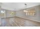 Formal dining room with hardwood floors and large windows at 2316 Harrier Way, Nokomis, FL 34275