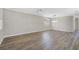 Spacious dining area with hardwood floors and adjacent living space at 2316 Harrier Way, Nokomis, FL 34275