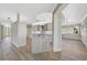 Kitchen island with seating in a spacious and bright open floor plan at 2316 Harrier Way, Nokomis, FL 34275