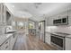 Bright kitchen with stainless steel appliances and granite countertops at 2316 Harrier Way, Nokomis, FL 34275
